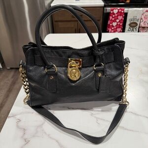 Black Leather Michael Kors bag, Gold accents, Gold & Leather shoulder strap.